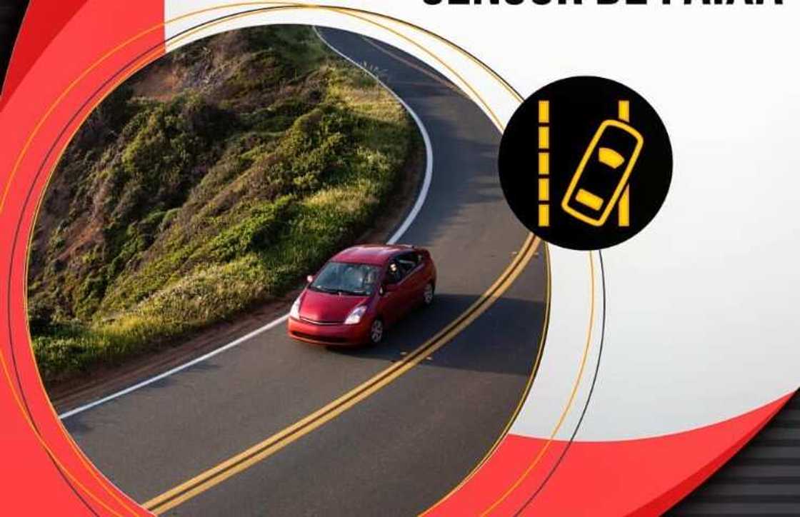 A red car on the road and a lane departure sign on the side A red car on the road and a lane departure sign on the side