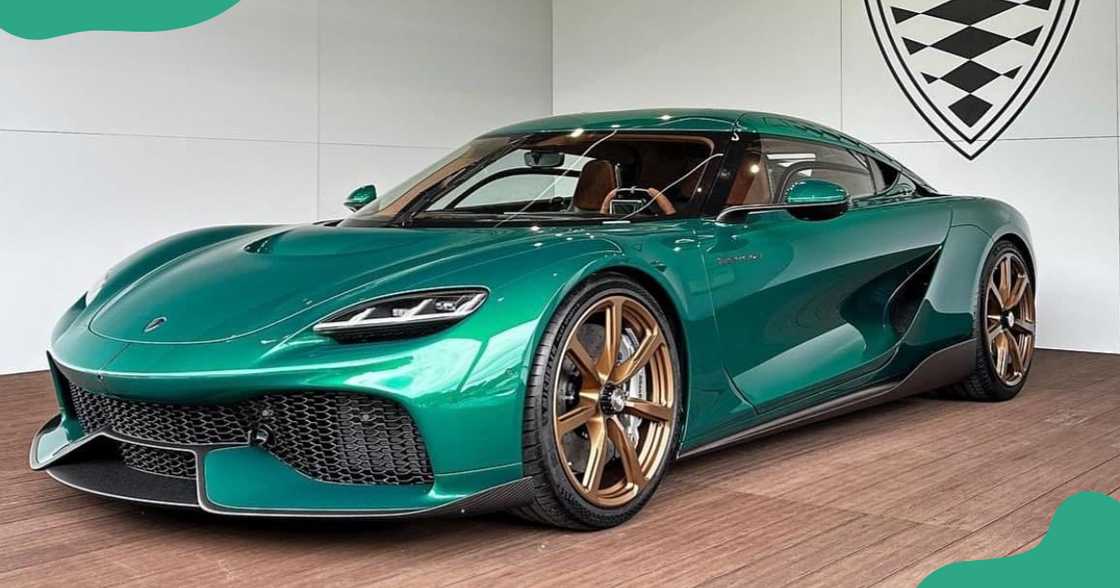A green Koenigsegg Gemera with gold rims A green Koenigsegg Gemera with gold rims