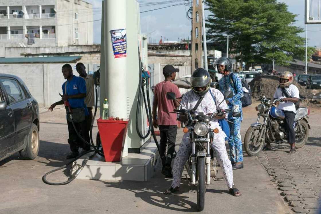 Petrol now is cheaper at official service stations than from traders on the street. Petrol now is cheaper at official service stations than from traders on the street.