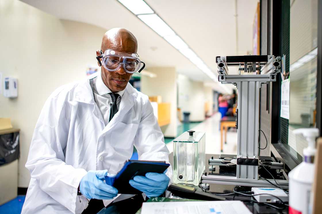 A man working in a chemistry lab on an experiment.