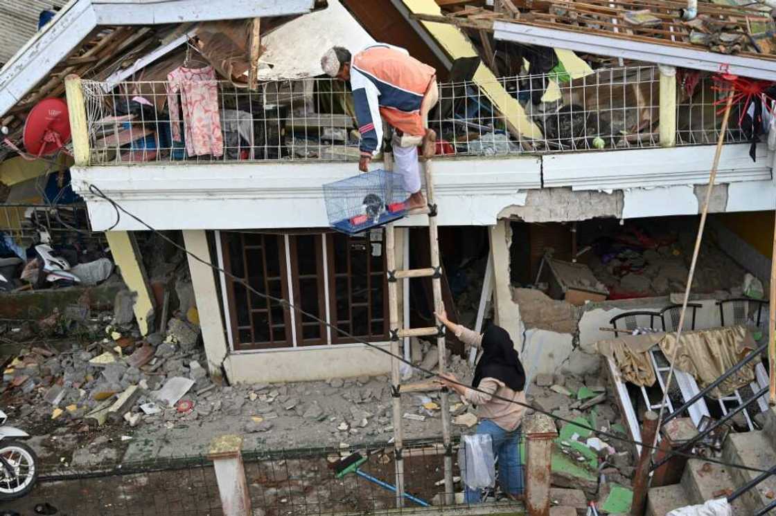 The rescue mission carried on into Tuesday to find those trapped by the disaster and residents tried to retrieve their pets and belongings The rescue mission carried on into Tuesday to find those trapped by the disaster and residents tried to retrieve their pets and belongings