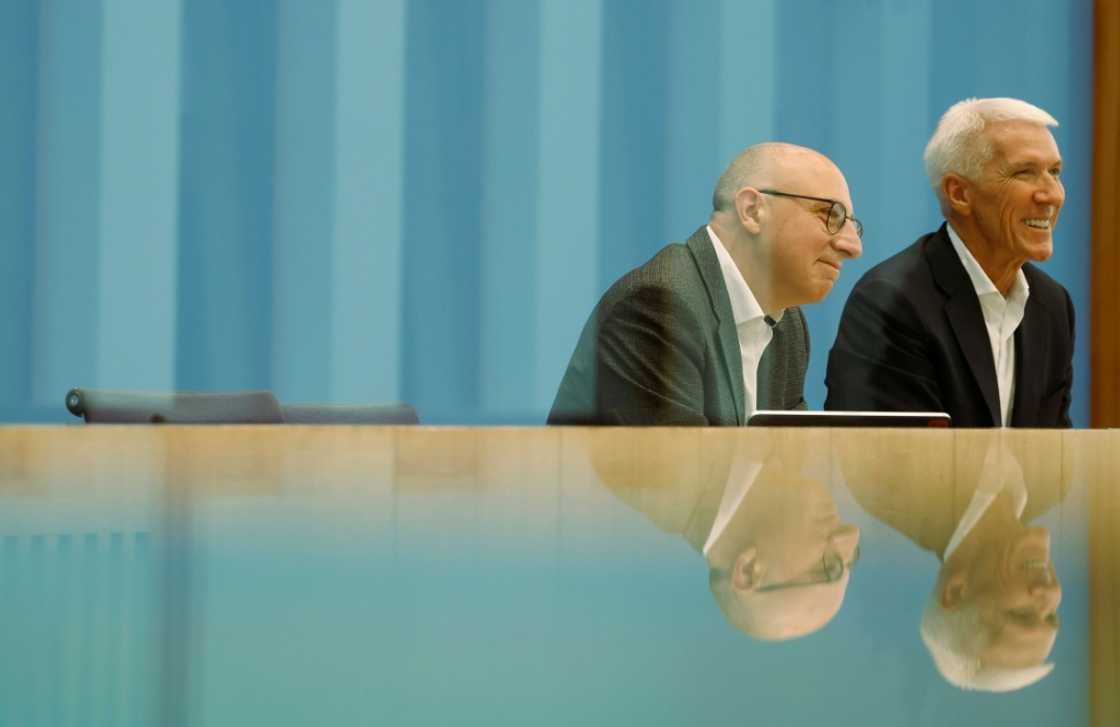 Sinan Selen (L), the designated head of Germany's BfV domestic spy service, and Bitkom president Ralf Wintergerst give a press conference in Berlin