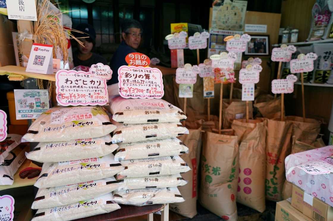 Bags of rice are seen at the entrance of a shop in Tokyo. Rice prices soared 90.7 percent in July year-on-year, but the rate of increase slowed from previous months Bags of rice are seen at the entrance of a shop in Tokyo. Rice prices soared 90.7 percent in July year-on-year, but the rate of increase slowed from previous months