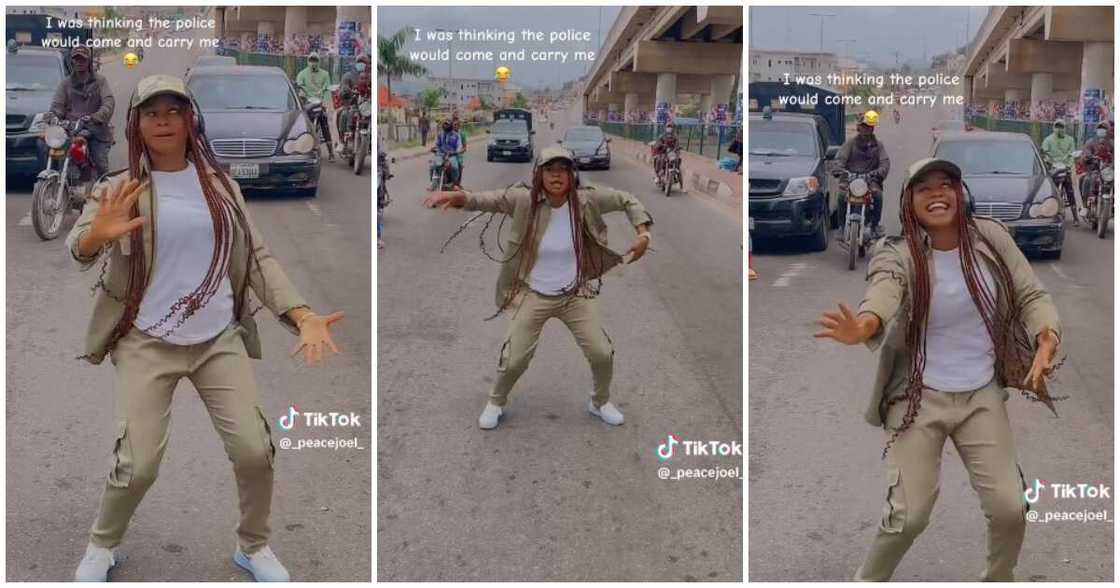 Female corps member dances, middle of the road