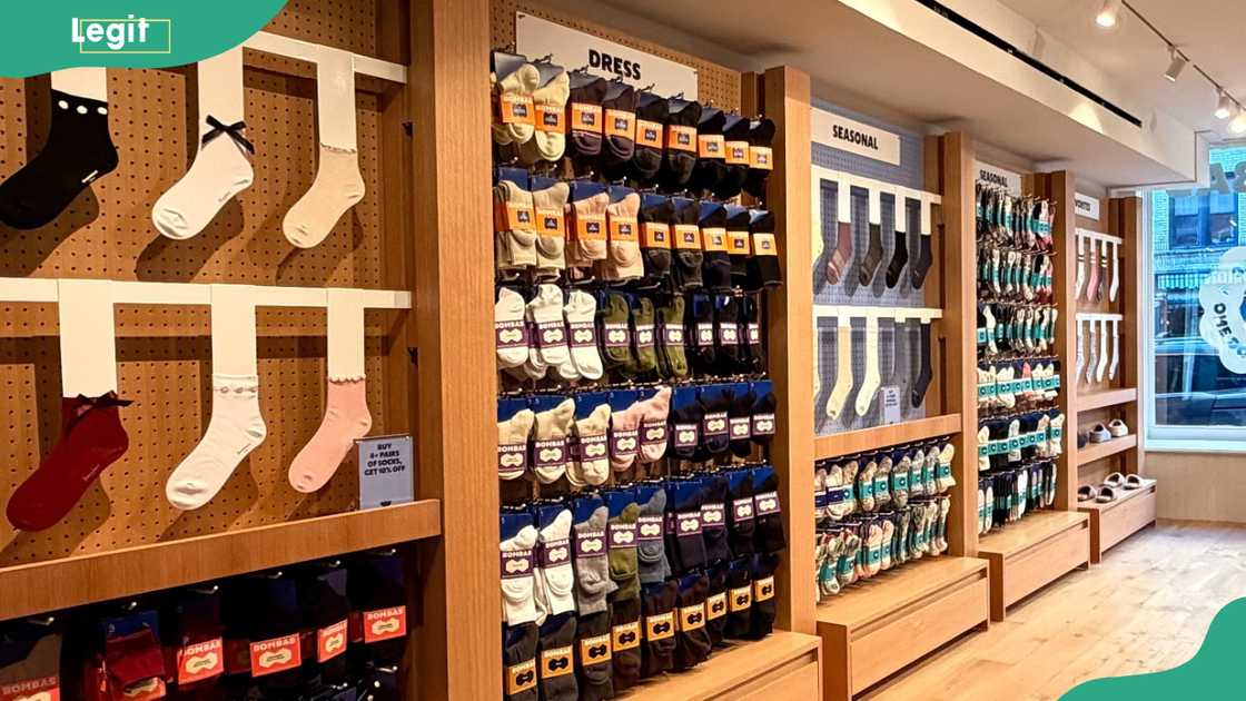 Bombas socks carefully organised on retail shelving, displaying a variety of colours