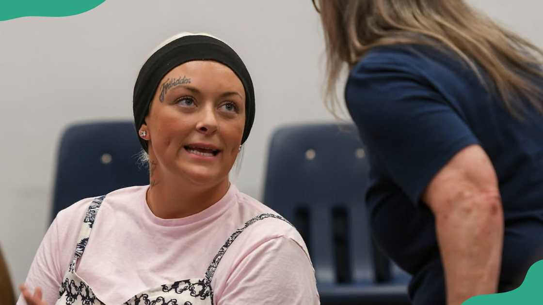 Grace Pauline Kelley speaks to a woman