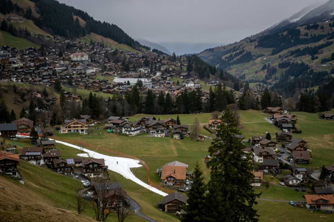 A slope amid a near-snowless landscape during the FIS Alpine ski World Cup events in the Swiss resort of Adelboden in January 2023 A slope amid a near-snowless landscape during the FIS Alpine ski World Cup events in the Swiss resort of Adelboden in January 2023