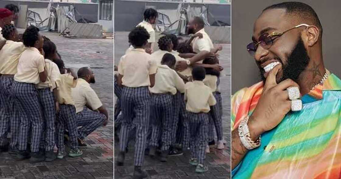 Children hug Davido joyfully, take photos Children hug Davido joyfully, take photos