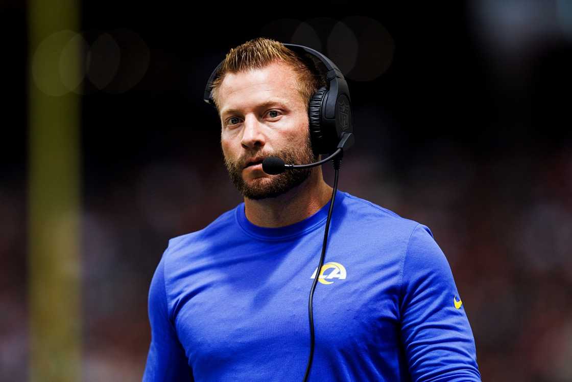 Sean McVay is pictured in a blue outfit and a headset during a game. Sean McVay is pictured in a blue outfit and a headset during a game.