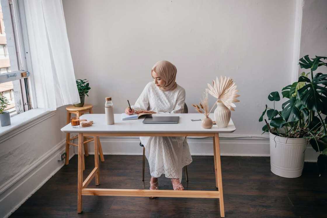 A female student in a room studying