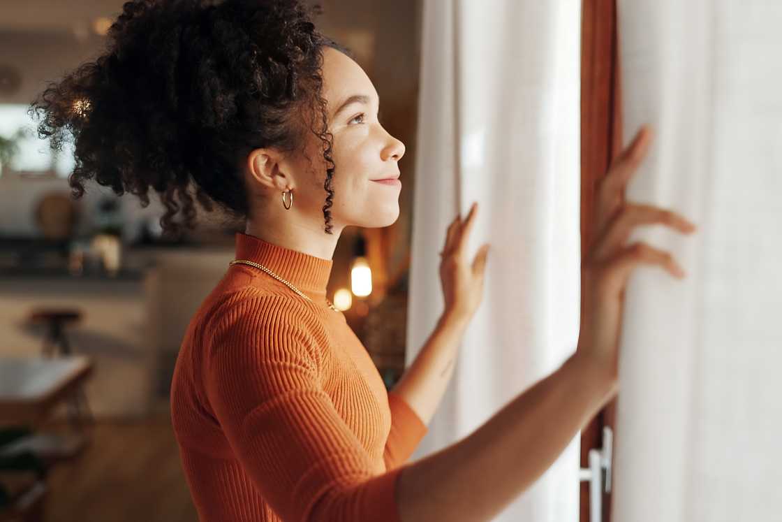 A happy woman thinks about the future