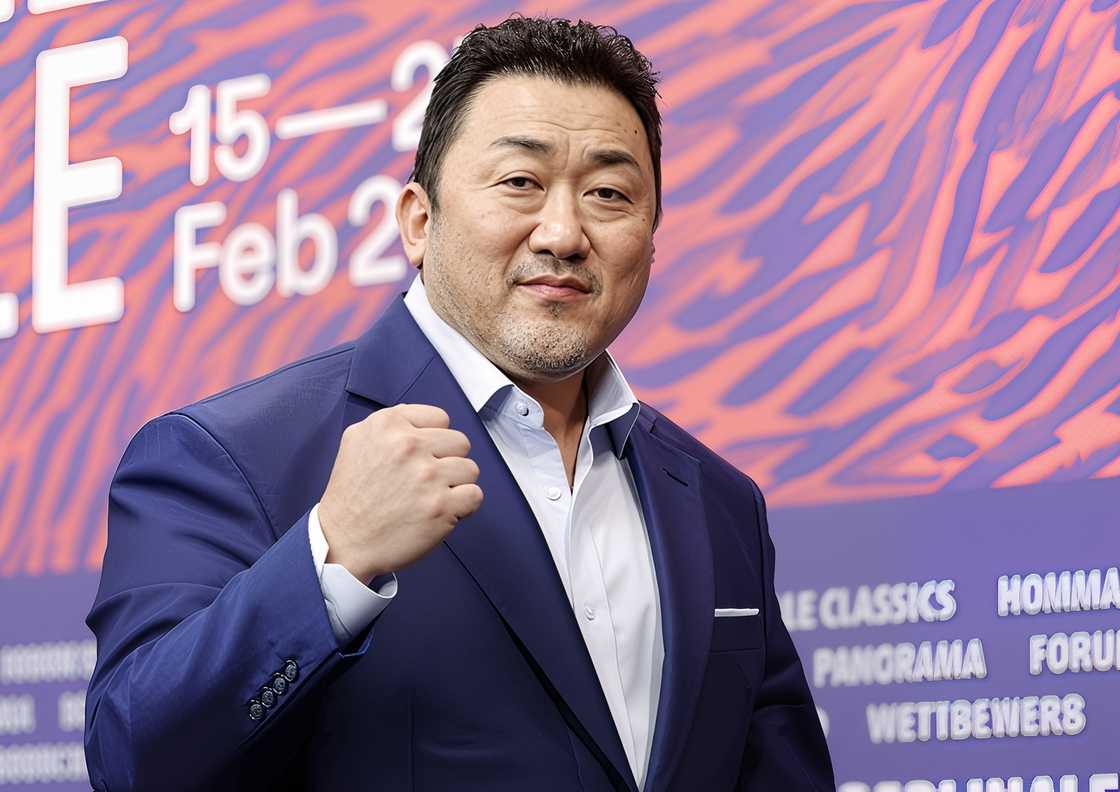 Ma Dong-seok gestures on stage