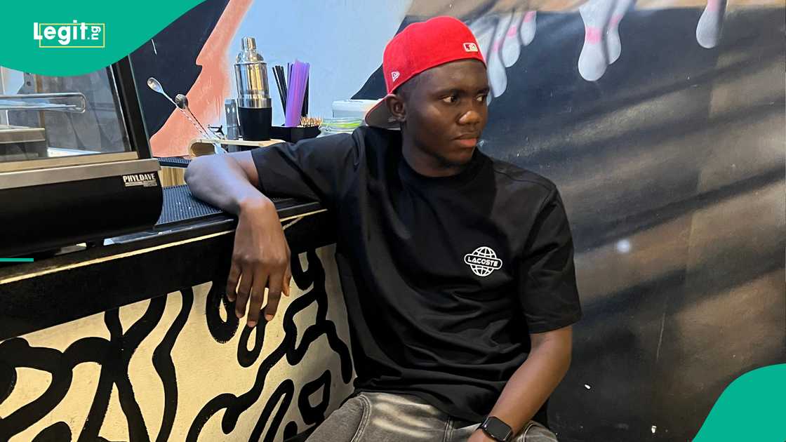 Man disappointed as lady snaps food during a date with him. Man disappointed as lady snaps food during a date with him.