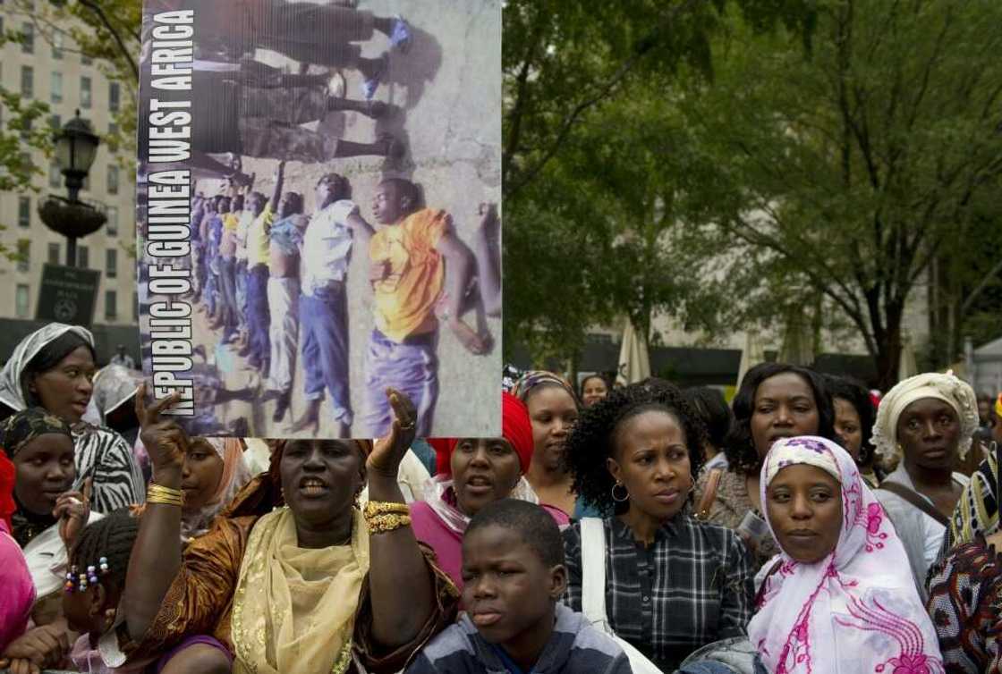 At least 157 people were murdered and 109 women raped in the 2009 massacre At least 157 people were murdered and 109 women raped in the 2009 massacre