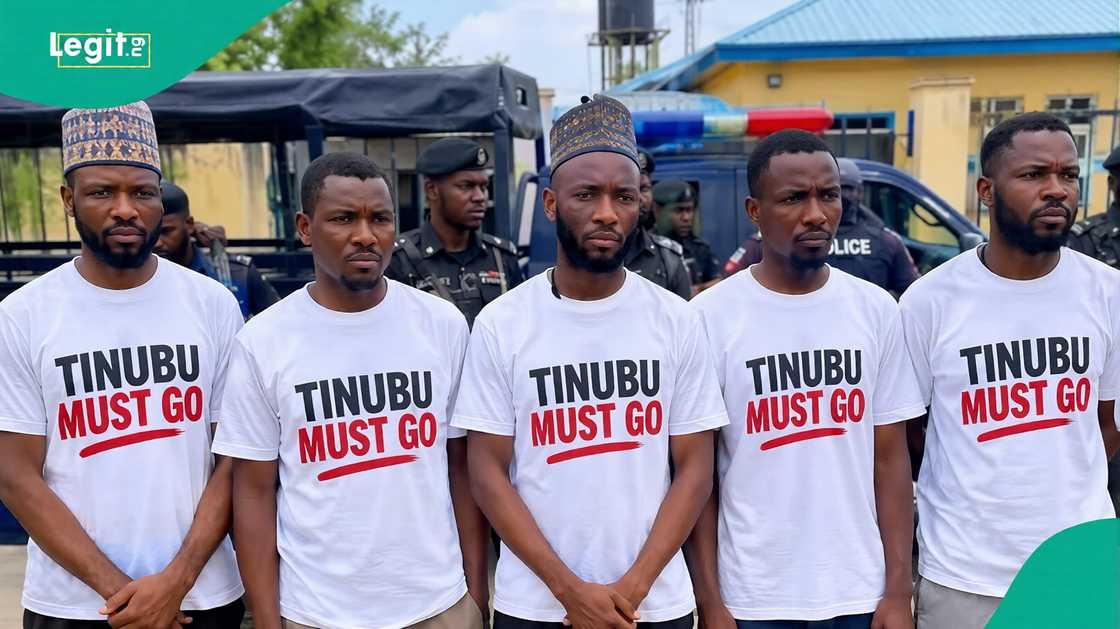 Police say the men wearing 'Tinubu Must Go' T-shirts had drugs on them when they were arrested.