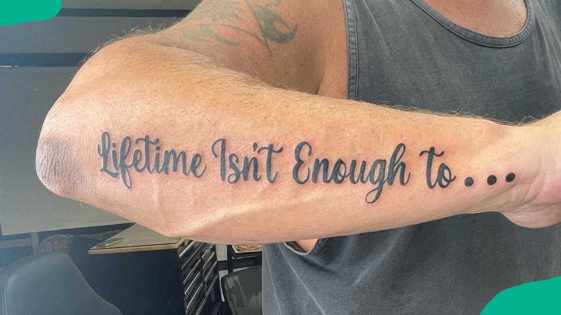 Forearm quote tattoo