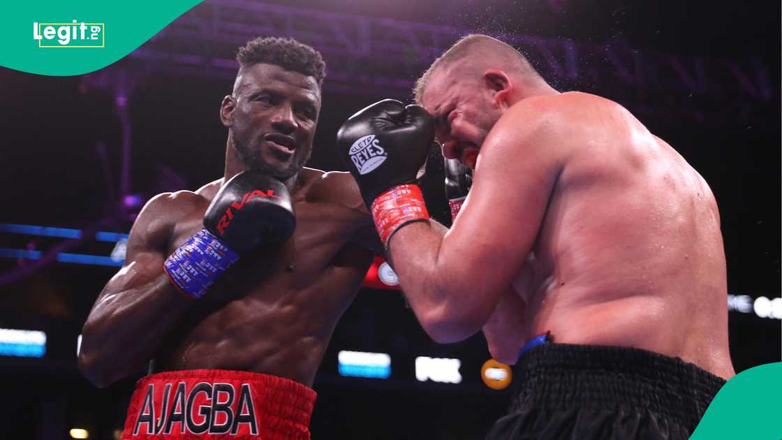Efe Ajagba punches Razvan Cojanu during their Heavyweight Championship bout in New York. Photo by Michael Owens