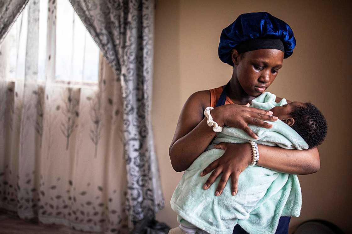African mother holding her newborn baby African mother holding her newborn baby