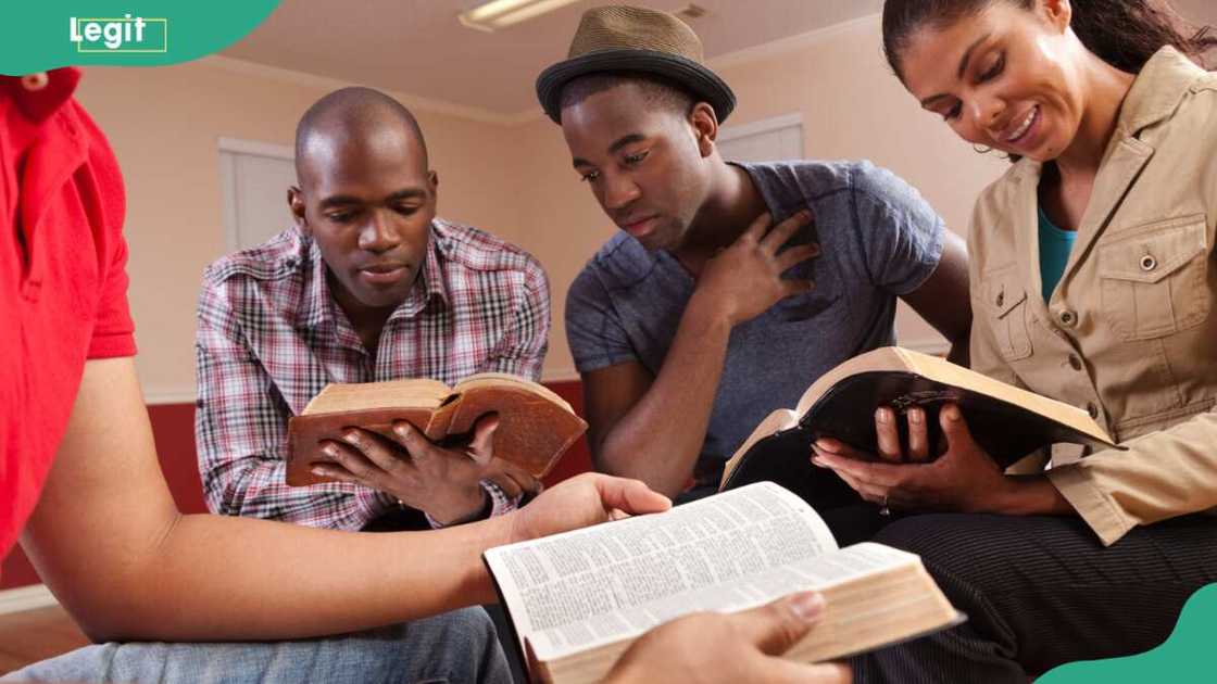 Young adults meeting together in a Bible study in Church fellowship hall Young adults meeting together in a Bible study in Church fellowship hall
