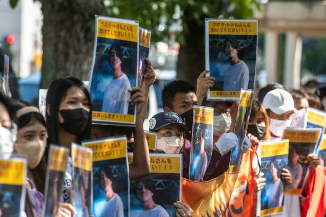 A small crowd rallied outside Japan's foreign ministry in Tokyo, holding placards of Kubota