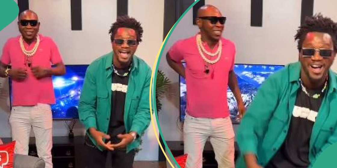 Seun Kuti jumps on Nasboi's umbrella challenge. Seun Kuti jumps on Nasboi's umbrella challenge.