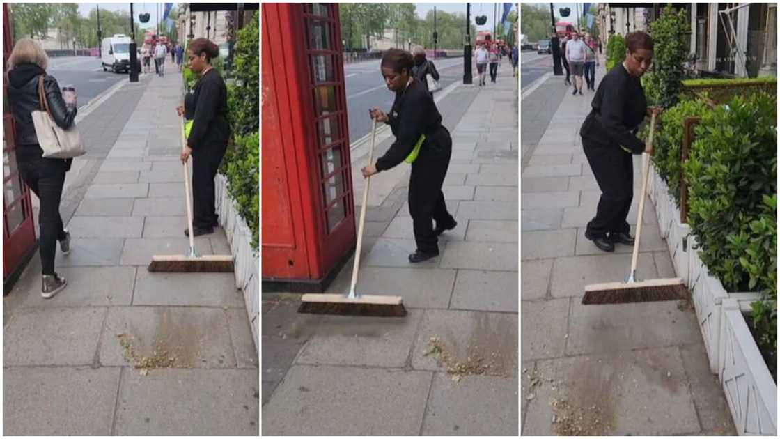 Working in UK/Woman sweeps the street. Working in UK/Woman sweeps the street.
