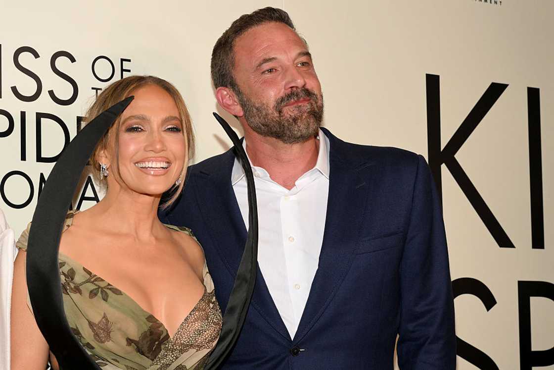 Jennifer Lopez (L) posing for a photo with Ben Affleck at an event Jennifer Lopez (L) posing for a photo with Ben Affleck at an event