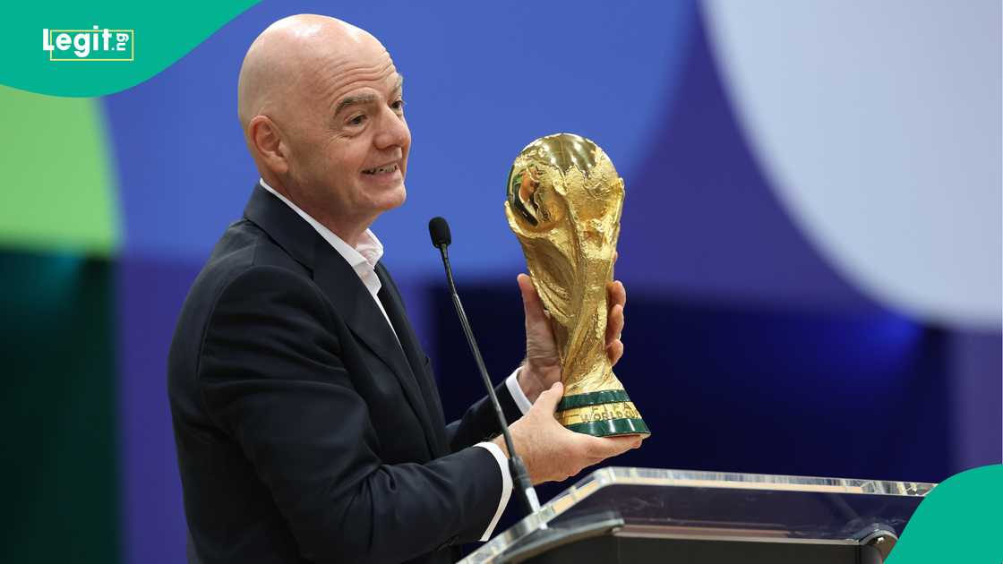 FIFA President Gianni Infantino holds the World Cup trophy. Photo by Sam Hodde