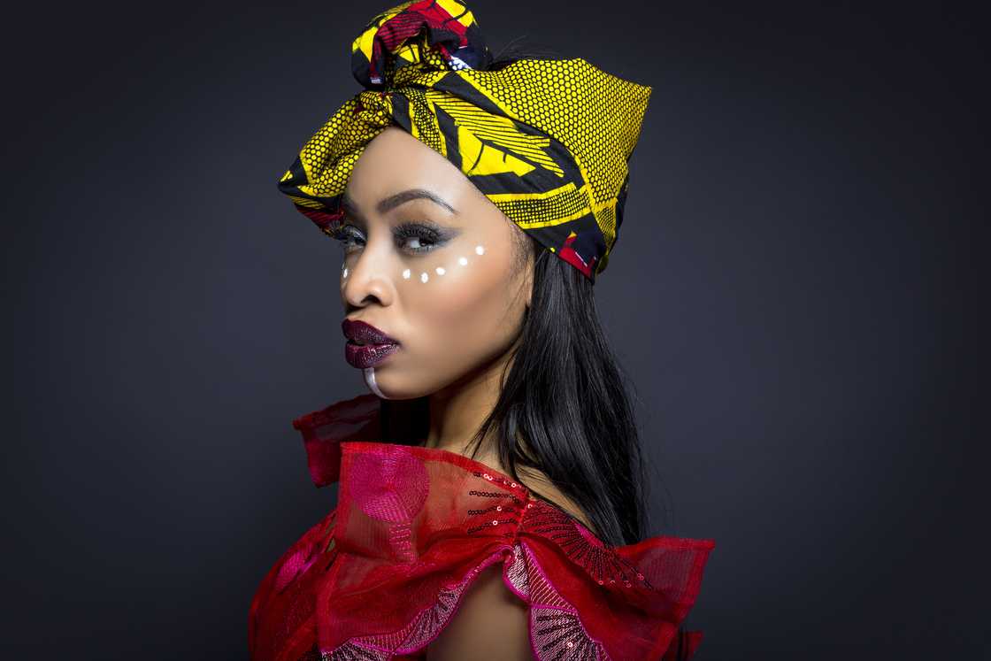 A Nigerian model wearing Nigerian traditional clothing and tribal makeup A Nigerian model wearing Nigerian traditional clothing and tribal makeup