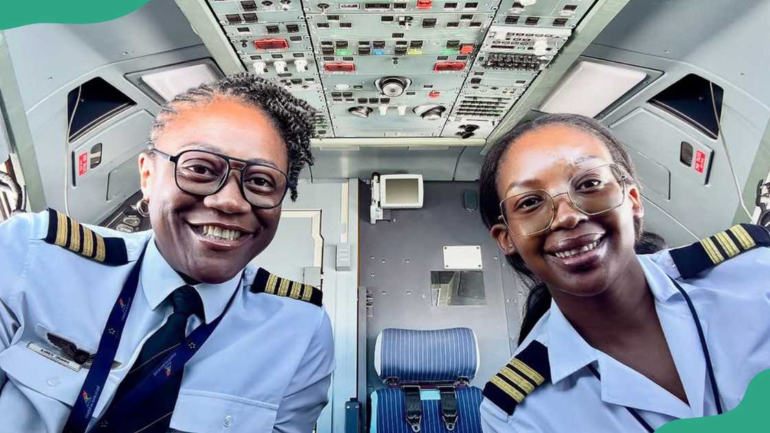 Two female pilots enjoy a moment in a plane's cockpit
