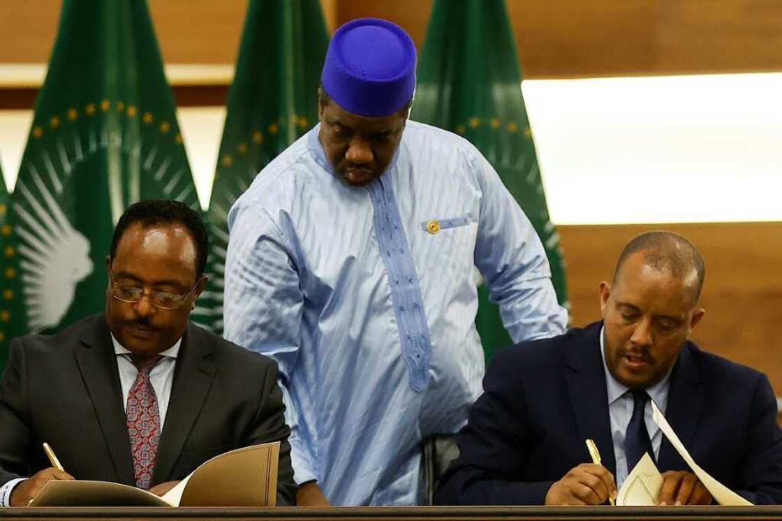 Ethiopian government representative Redwan Hussein and Tigrayan delegation leader Getachew Reda seal the deal in Pretoria Ethiopian government representative Redwan Hussein and Tigrayan delegation leader Getachew Reda seal the deal in Pretoria