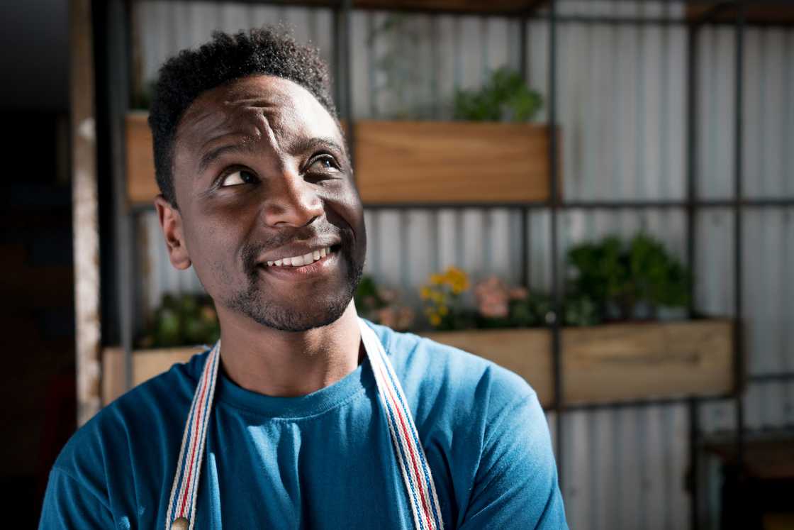 A businessman in deep thoughts reflecting on his life A businessman in deep thoughts reflecting on his life