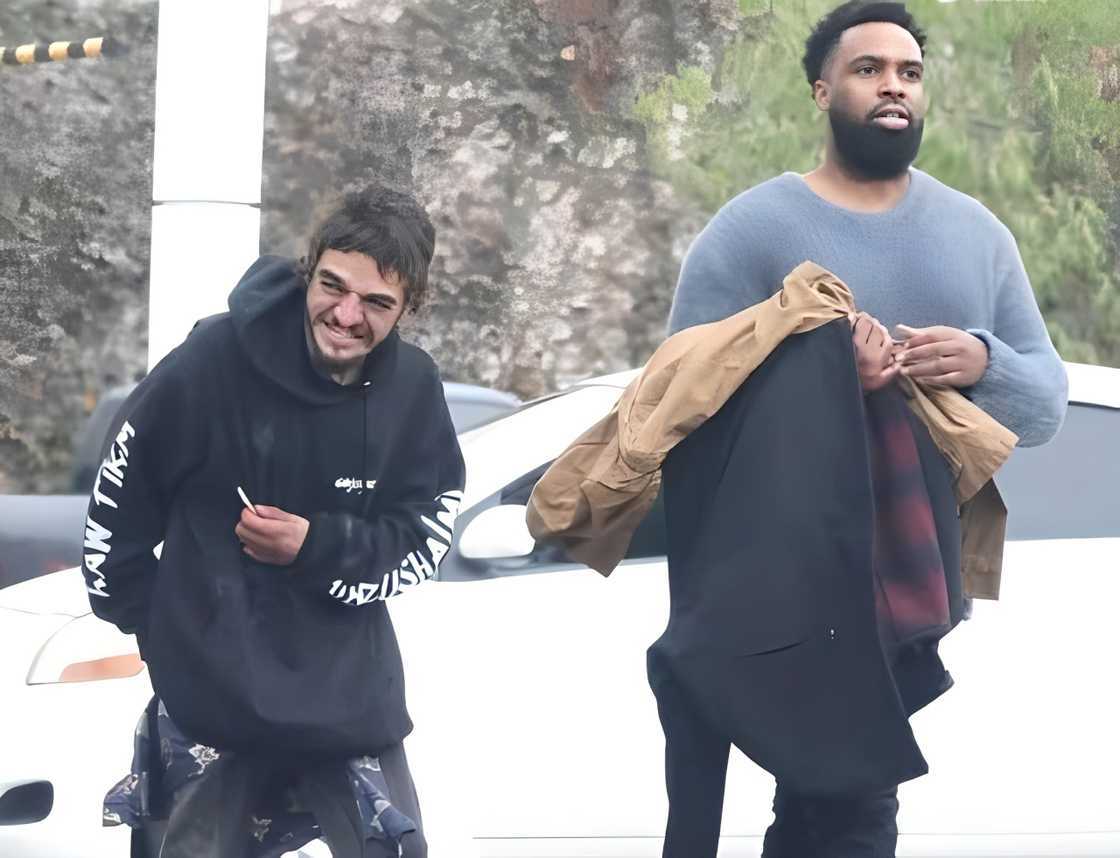 Tylor Chase walks with Daniel Curtis Lee.