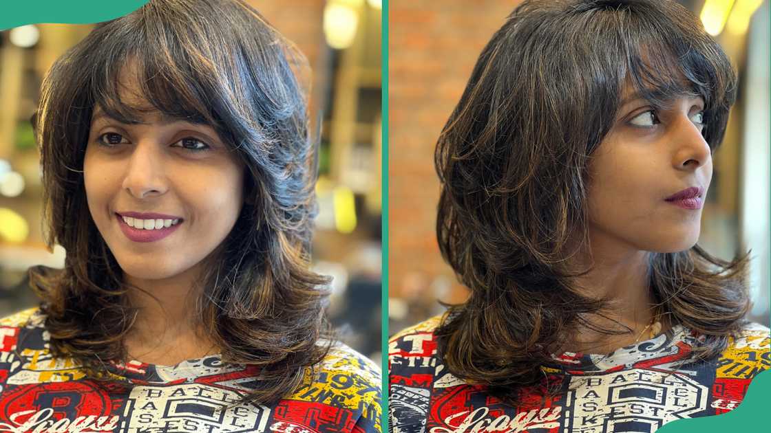 A woman show off her wolf cut hairstyle