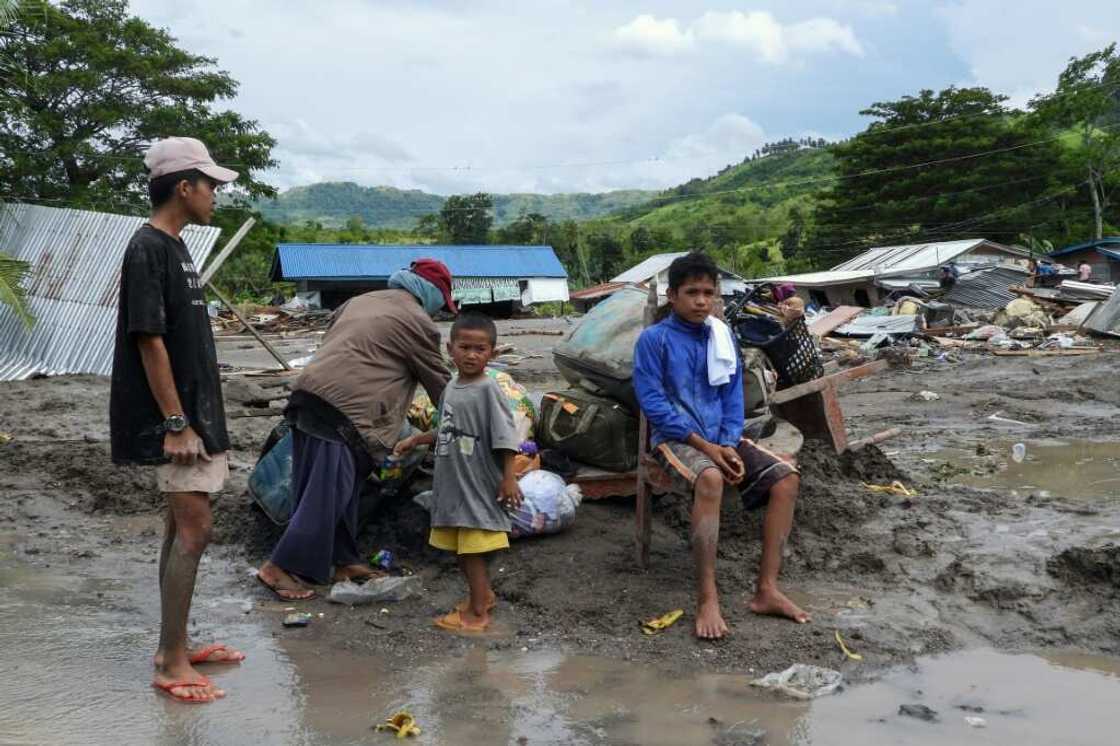 Fourteen bodies have been recovered from the village so far. They are among 40 confirmed deaths in a series of flash floods and landslides ahead of Nalgae's landfall Fourteen bodies have been recovered from the village so far. They are among 40 confirmed deaths in a series of flash floods and landslides ahead of Nalgae's landfall