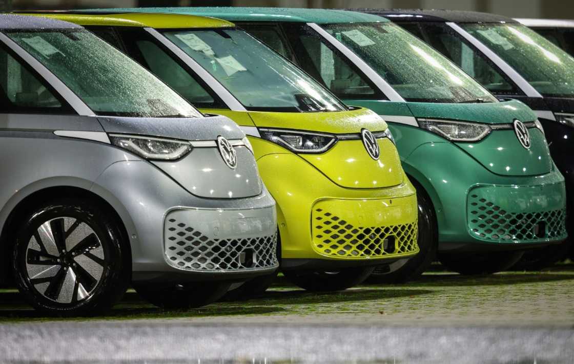 New VW ID Buzz vehicles next to the commercial vehicle plant of German car manufacturer Volkswagen (VW) in Hanover, northern Germany, before delivery on 19 December 2024