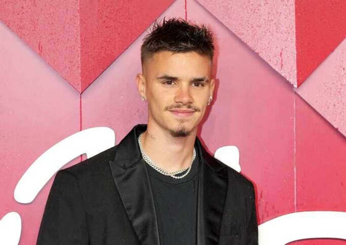 Romeo Beckham poses for a photo at The Fashion Awards 2023 at the Royal Albert Hall