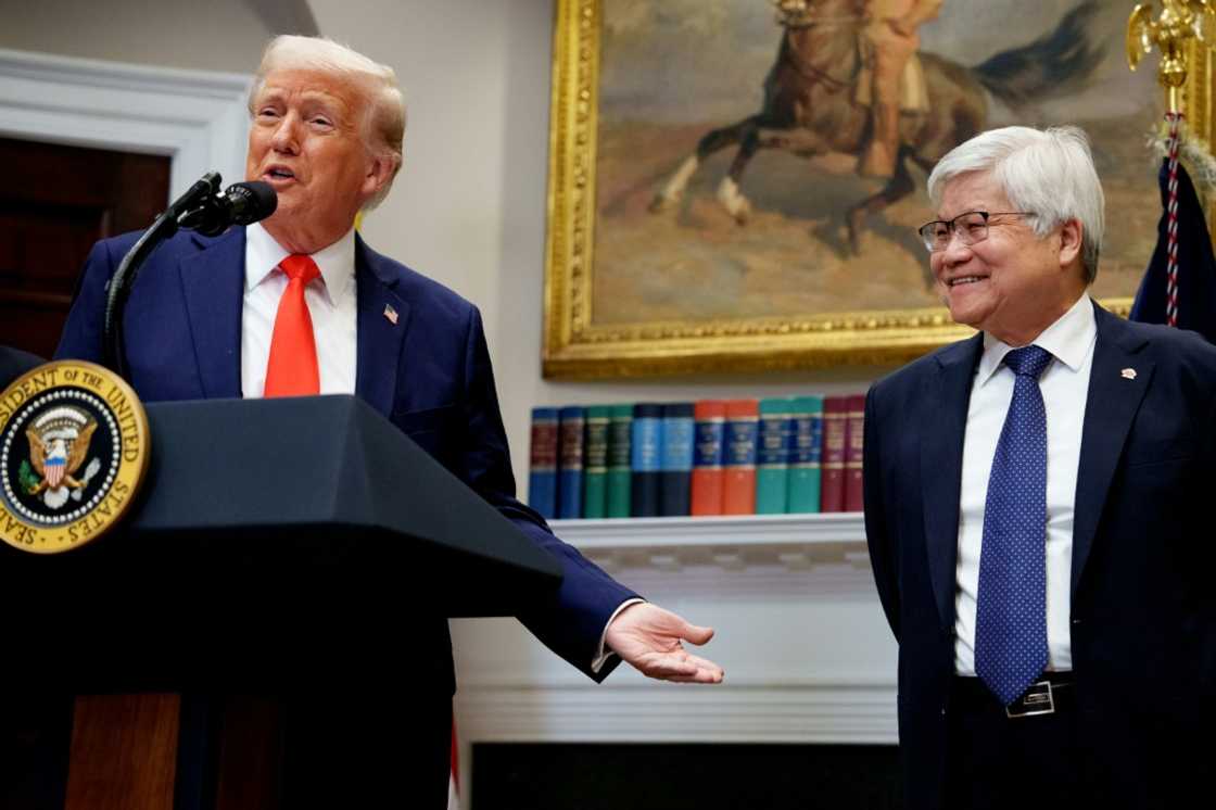 US President Donald Trump (L), with Taiwanese chip-maker TSMC's CEO C.C. Wei (R), speak to journalists at the White House