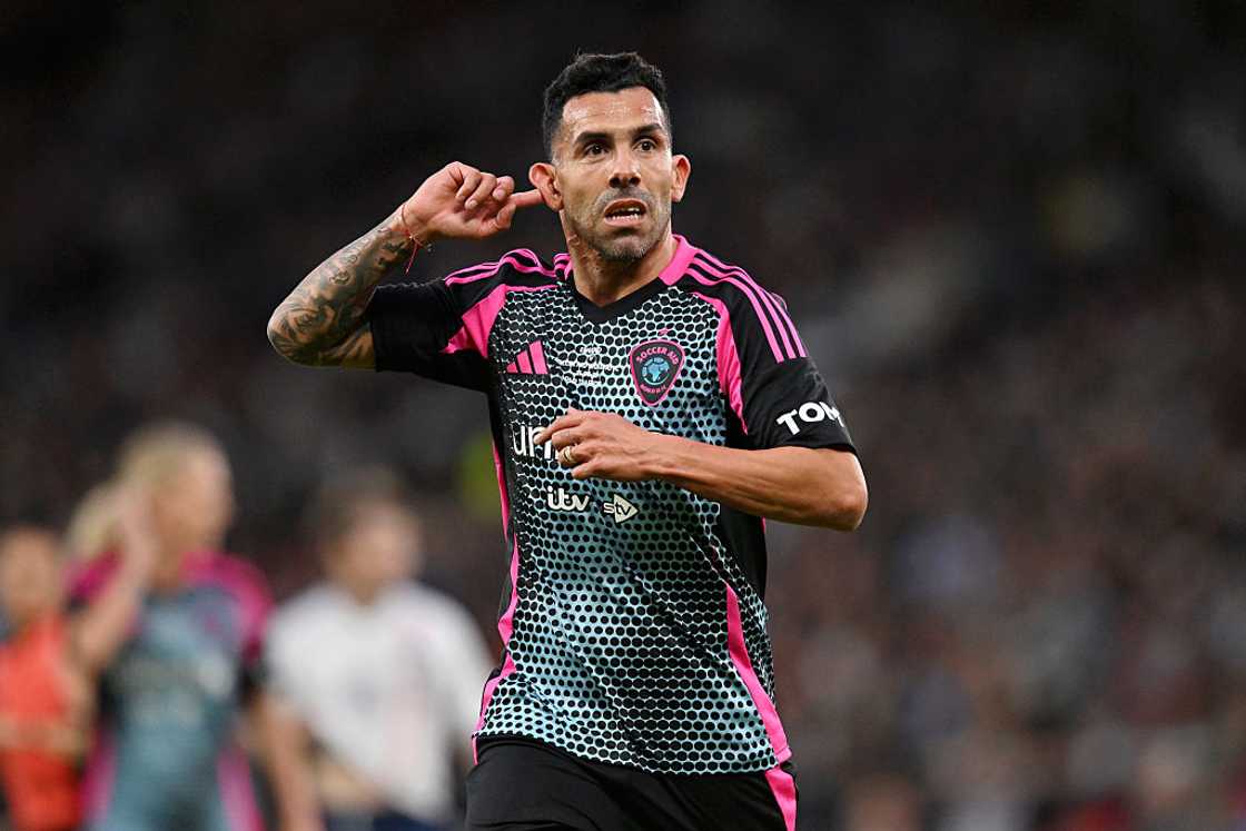 Carlos Tevez celebrates after scoring Carlos Tevez celebrates after scoring
