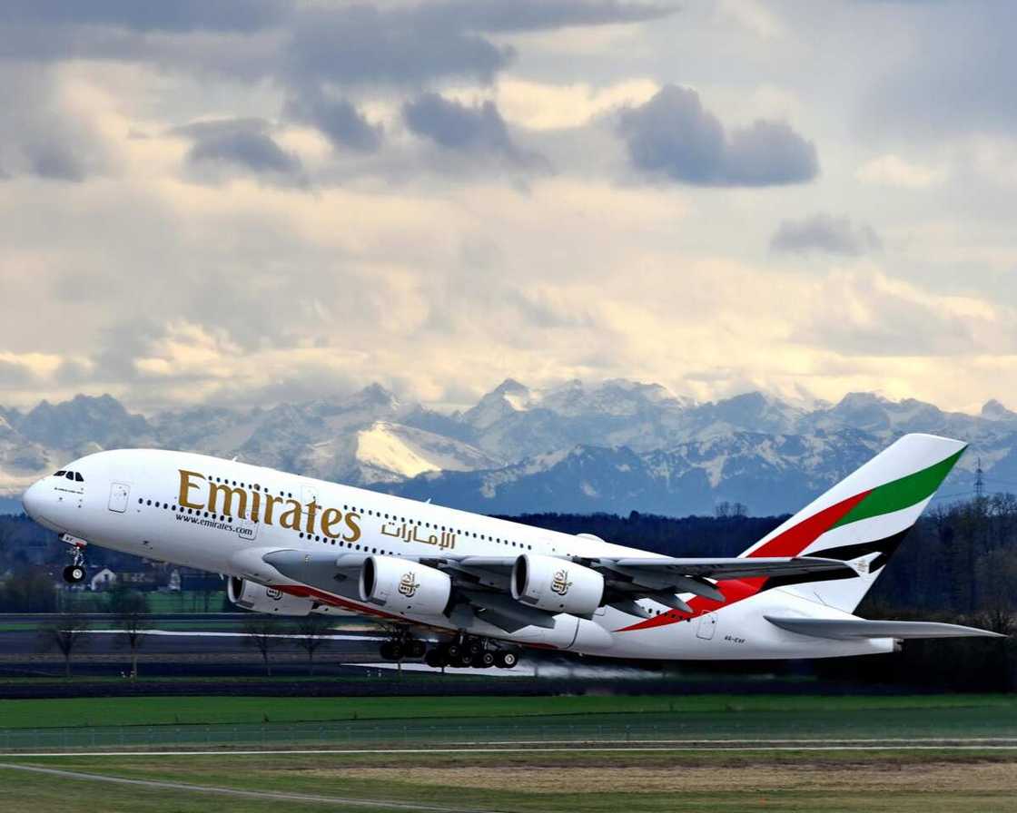 An aircraft of Emirates taking off An aircraft of Emirates taking off