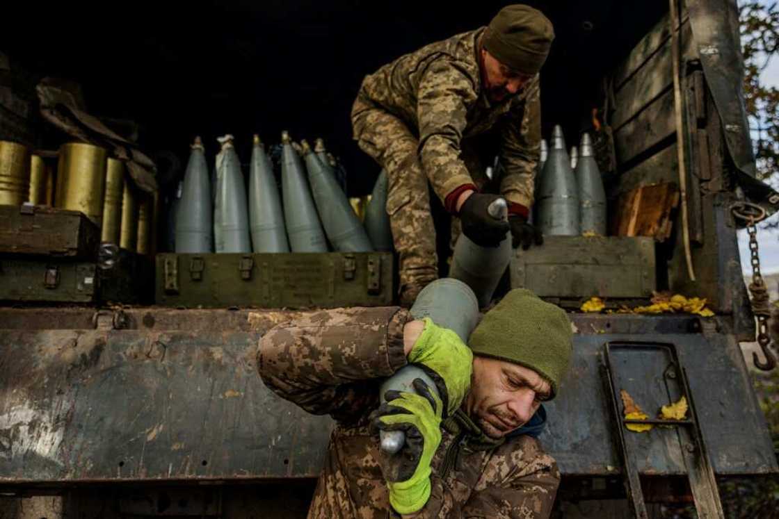 Ukrainian artillerymen unload shells from a military truck on the front line near Bakhmut Ukrainian artillerymen unload shells from a military truck on the front line near Bakhmut