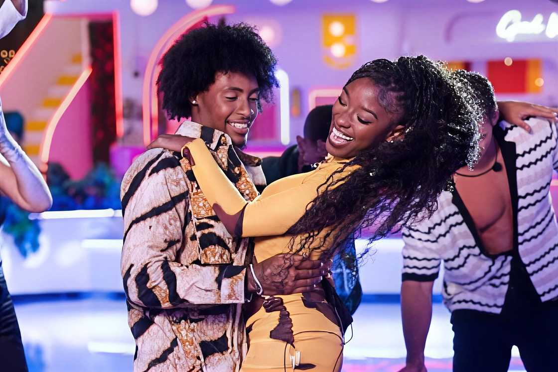 Serena Page and Kordell Beckham hold each other in a dance Serena Page and Kordell Beckham hold each other in a dance