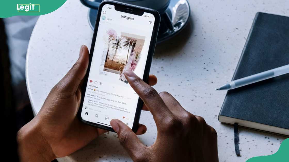 A person scanning through Instagram on a smart phone A person scanning through Instagram on a smart phone