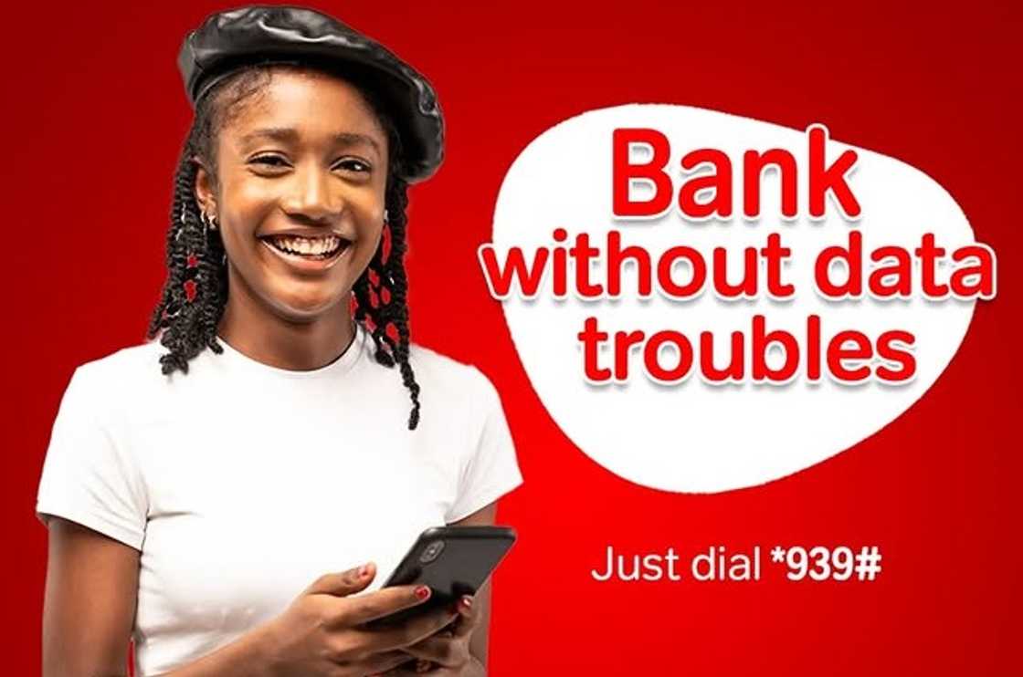 A lady smiling while holding her phone A lady smiling while holding her phone