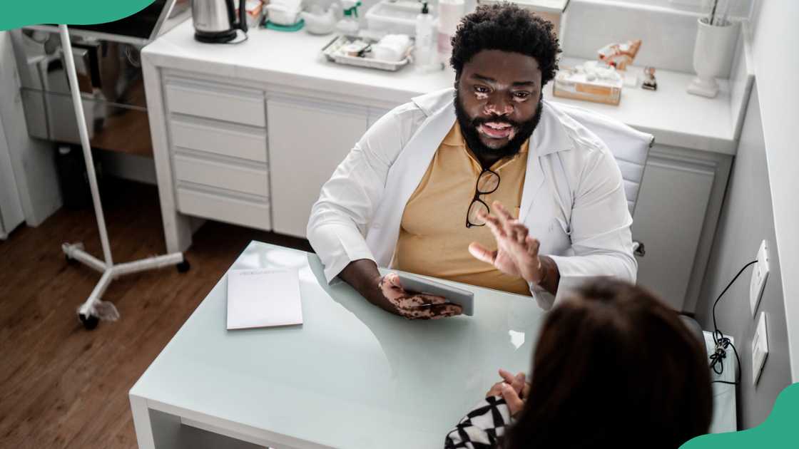 A woman talks to a consultant in an office