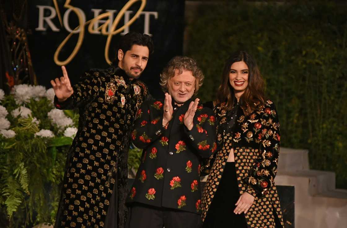 Indian designer Rohit Bal (center) gestures at his fashion show in Mumbai in 2019 Indian designer Rohit Bal (center) gestures at his fashion show in Mumbai in 2019
