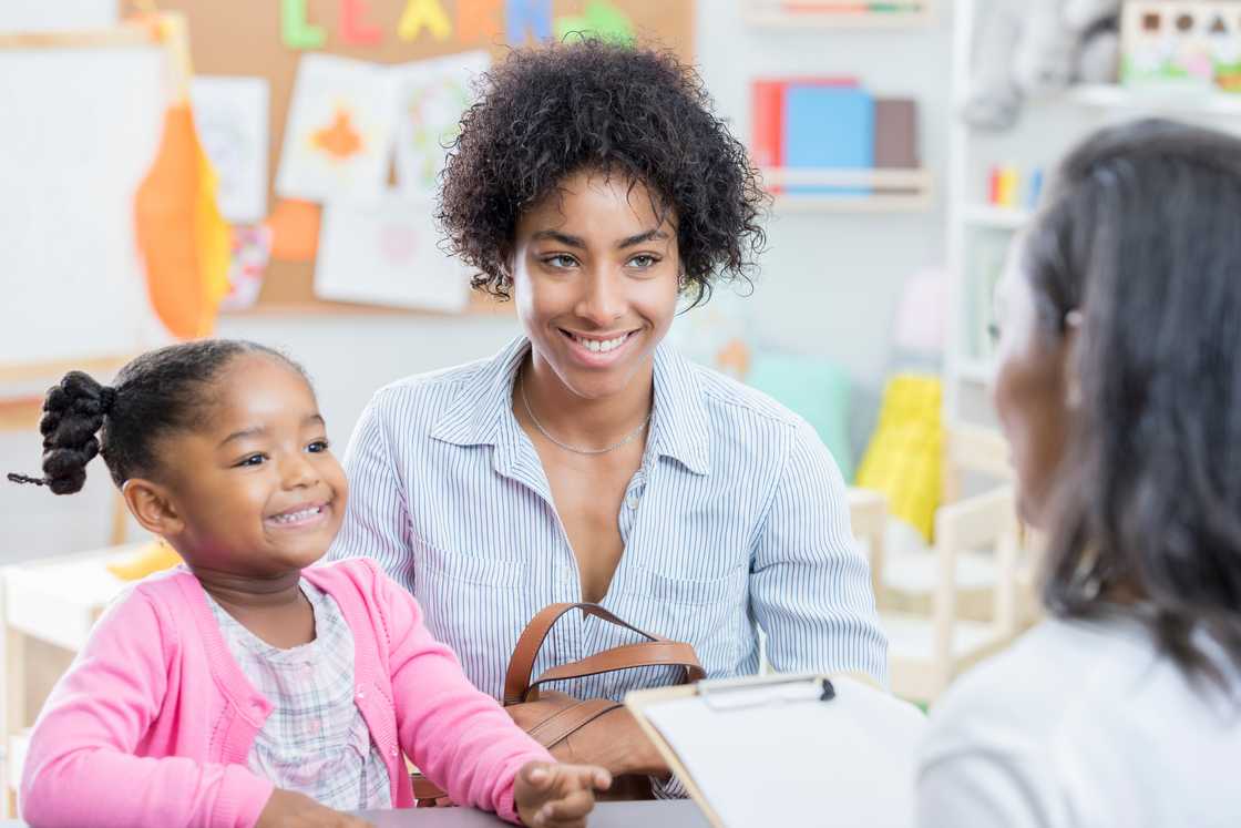 Mother and daughter at the school office reception.