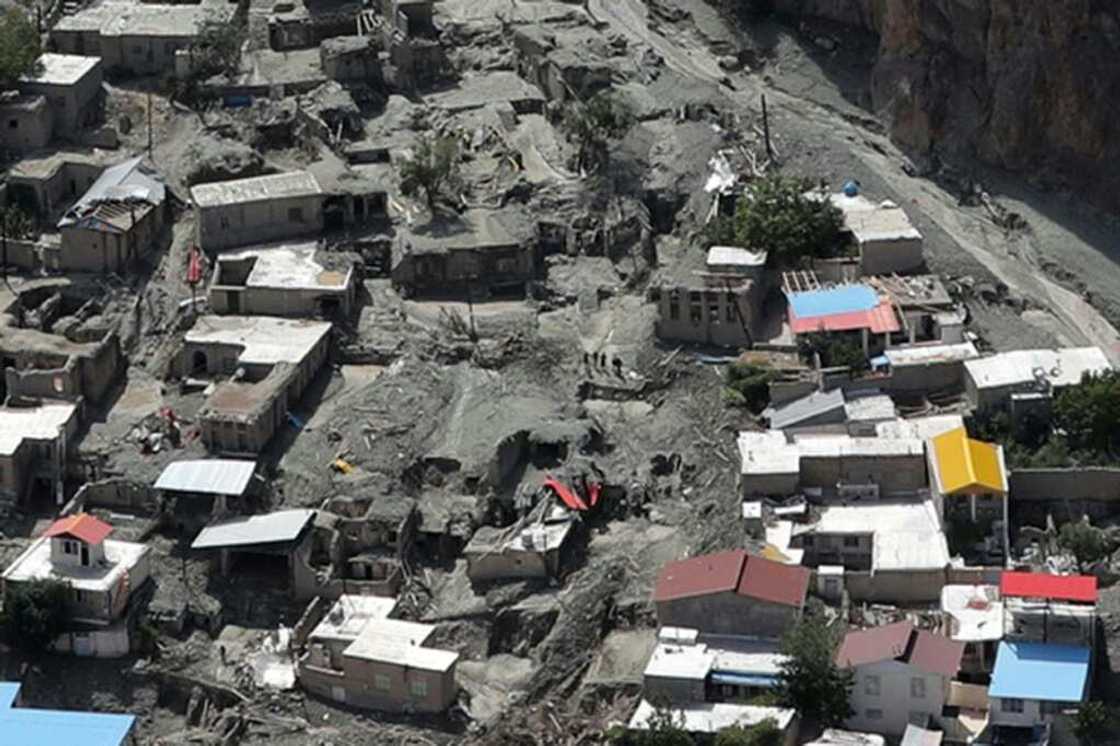 Houses surrounded by mud deposits at the site of a flash flood east of Tehran in the Firouzkouh area, where a landslide killed 14 people Houses surrounded by mud deposits at the site of a flash flood east of Tehran in the Firouzkouh area, where a landslide killed 14 people