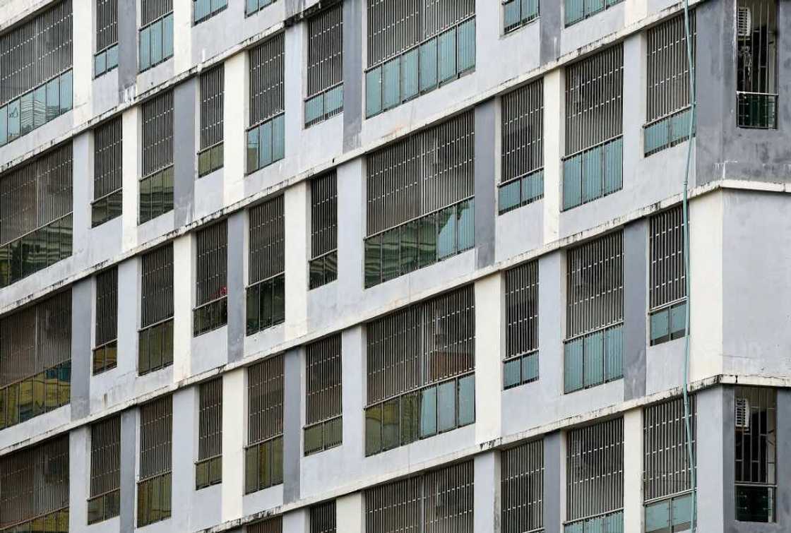 Steel bars cover the windows of empty buildings inside the Chinatown district in Sihanoukville in Preah Sihanouk province