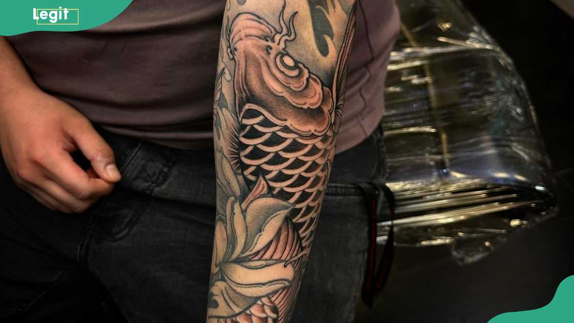 Fish forearm tattoo